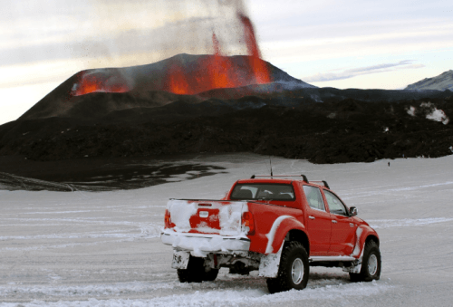 Hilux overlooking erupting volcano
